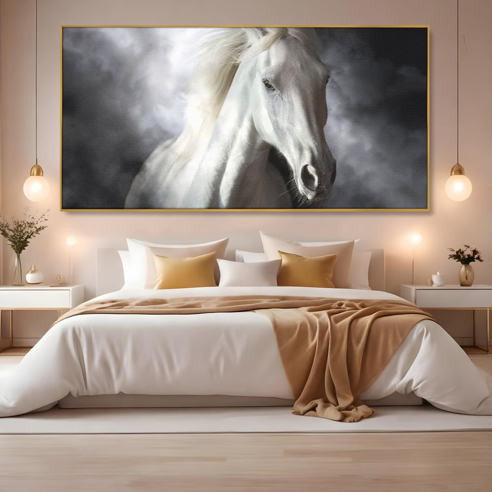 Tablou canvas cu tablou canvas cu un cal alb si nori, in rama de aluminiu auriu, pe perete intr-un dormitor